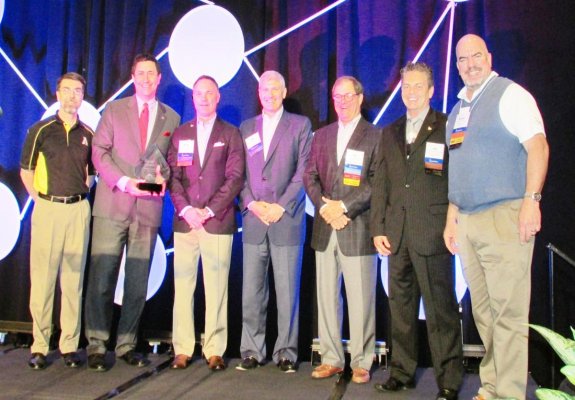 Greg Langdon presents IIANC CEO Aubie Knight and members of the Board of Directors Scott Evans, Jeff Haney, Bill Vogedes, Jim Mozingo and past Chairman Bobby Salmon with the “Founding Strategic Partner” sculpture